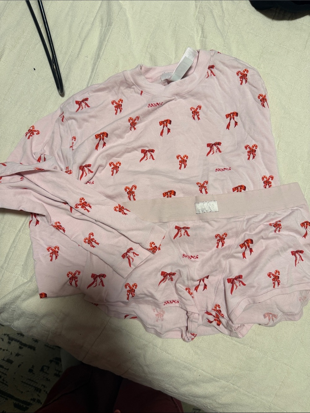 SKIMS Pink Pajama Set with Red Bow Print